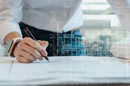 Man amends architectural drawings