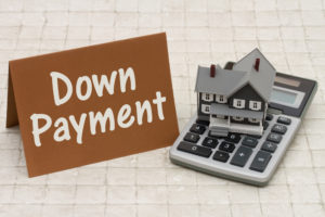Home Mortgage Down Payment, A gray house, brown card and calcula